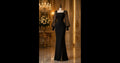 This sleek black evening gown combines dramatic vintage accents