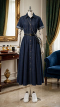 A dark indigo denim midi shirt dress styled in a smart-casual aesthetic